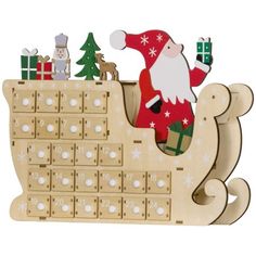 a wooden calendar with a santa clause on it's back and christmas decorations in the background