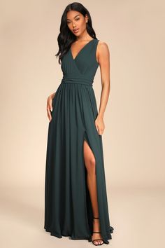 The Lulus Thoughts of Hue Emerald Green Surplice Maxi Dress will have you dreaming of romantic evenings under starlit skies! Lightweight woven chiffon drapes into a sleeveless, surplice bodice and V-back, atop a banded waistline. Cascading skirt falls to a maxi hem with a sultry side slit. Hidden back zipper with clasp. Fit: This garment fits true to size. Length: Floor length. Size medium measures 61" from shoulder to hem. Bust: Great for any cup size. Waist: Fitted - very fitted at natural waist. Hip: Not Fitted - fuller skirt allows room for hips. Undergarments: May be worn with any standard bra. Fabric: Fabric has no stretch. Fully lined. Shell: 100% Polyester. Lining: 100% Polyester. Dry Clean Only. Imported. Lulus | Thoughts of Hue Emerald Green Surplice Maxi Dress | Size X-Large | 1 Black Tie Wedding Guest Dress, Black Tie Wedding Guests, Maid Of Honour Dresses, Emerald Green Dresses, Green Bridesmaid, Formal Dresses Gowns, Green Bridesmaid Dresses, Maxi Dress Navy, Fall Skirts