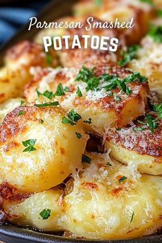 potatoes with parmesan cheese and parsley on top in a cast iron skillet