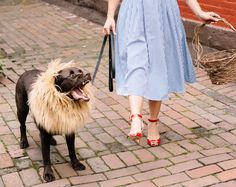 a woman walking her dog on a leash