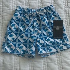 These Cute Nwt Hawaiian Board Shorts With Mesh Lining Are Made Of Lightweight 4-Way Stretch Fabric For Easy Movement In Or Out Of The Water. The Elastic Waist Has A Functional Drawstring, Allowing For A Comfortable Fit. These Board Shorts Even Have 2 Side Pockets, Also With Mesh Lining. Great For Fun At The Beach Or Pool! Note: Very Small Red Dot From Pen Near Slot For Drawstringcame From Manufacturer With This. Refer To Image 4. -From Smoke-Free, Pet-Free Home -Free Shipping On All Orders Over $75 Toddler Boy Swim Trunks, Kids Swim Trunks, White Palm Tree, Fun At The Beach, Boys Ties, Boys Swim Trunks, Baby Swimming, Blue And White Style, Striped Swimsuit