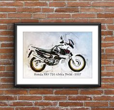 a framed photo of a motorcycle on a brick wall