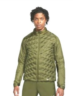 This Nike Therma-Fit ADV Repel Down Running Jacket is perfect for any active man. The olive color and windbreaker style make it suitable for both casual and exercise wear. It is made with polyester outer shell material and down fabric type, ensuring comfort and warmth during any activity. The jacket is part of the Nike Therma product line, designed for running and jogging. It is available in size M and the model number is DD5667-334. The brand is Nike, a well-known and trusted name in the industry. The jacket is suitable for men of all sizes and types. Soccer Drills, Runners World, Man Down, Athleisure Wear, Running Jacket, Shop Mens Clothing, Man Running, Long Sleeves Jacket, Nike Running