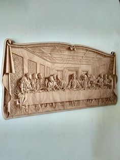 the last supper carved into a wall hanging