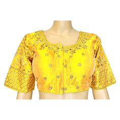 This stunning Yellow Color Gold Embroidered Readymade Blouse. Made with luxurious Phantom Silk and adorned with intricate Khatli work, this designer blouse is perfect for any special occasion. The padded construction, round neck, and hook and eye closure provide both comfort and elegance. Burst Size: 38 inch Waist Size: 34 inch Blouse Height: 14.5 inch Sleeve length: 11.5 Inch Pattern: Front open pattern with hook Padded: Yes Disclaimer: Color may vary slightly due to lighting or device settings Cheap Embroidered Yellow Blouse, Cheap Yellow Blouse Piece For Puja, Semi-stitched Blouse With Intricate Embroidery For Wedding, Anarkali Blouse With Intricate Embroidery For Wedding, Anarkali Wedding Blouse With Intricate Embroidery, Anarkali Embroidered Wedding Blouse, Semi-stitched Embroidered Blouse For Wedding, Embroidered Semi-stitched Blouse For Wedding, Embroidered Saree Blouse For Wedding