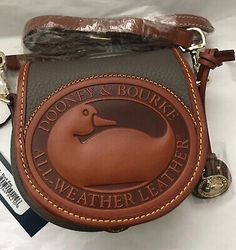 Find ideas๏ฟฝand inspiration for New DOONEY & BOURKE BIG DUCK CROSSBODY Taupe Pebble And Tan All Weather Leather, Womens Bags Big Duck, Dooney And Burke, Duck Bag, Shopping Ideas, Dooney Bourke Handbags, Women's Bags, Dooney Bourke, Random Stuff, Fashion Bags