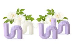 the letters have flowers in them and are purple