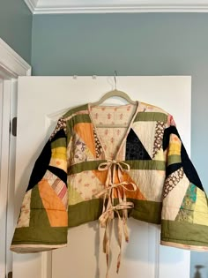 an open jacket hanging on the wall