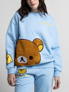 Long sleeve, ribbed crew neck sweatshirt Embroidered logo on the front Embroidered chenille patch with satin stitching Embroidered Kiiroitori on the sleeve 100% cotton Imported Officially licensed Rilakkuma merchandise The male model is wearing a large sweatshirt.The female model is wearing a small sweatshirt. Sweat Sets, Chenille Patch, Sweat Set, Little Outfits, Rilakkuma, Satin Stitch, Female Model, Male Model, Apparel Accessories