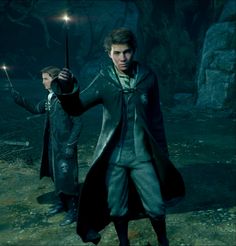 harry potter and hermione's hogwarts are holding wands in their hands