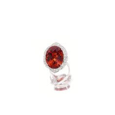 SPESSARTITE GARNET AND DIAMOND RING. Centring on an oval spessartite garnet weighing 29.46 carats, to a stylised mount set with circular-cut diamonds, mounted in platinum Jewel Tattoo, Garnet And Diamond Ring, Red Ring, Spessartite Garnet, Art Old, Garnet Rings, Exhibitions, Fashion Ideas, Precious Stones