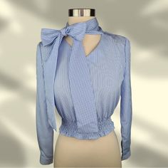 Striped Bow Tie Pleated Blouse Style: Crop Top Condition: Brand New With Tag Size & Fit: - Size: Small (Runs Small, More Like X-Small/Xx-Small) - Length Of Blouse: 15 1/2” Inches - Bust: 17 1/2” Inches - Sleeves: 22 1/2” Inches Blue Tie Neck Tops For Spring, Blue Tie Neck Top For Office, Blue Fitted Tie Neck Tops, Blue Fitted Blouse With Tie Neck, Blue Fitted Tie Neck Blouse, Fitted Tie Neck Blouse For Brunch, Elegant Blue Blouse For Day Out, Elegant Light Blue Tops For Day Out, Elegant Blue Blouse For Brunch