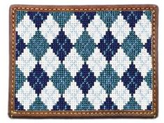 a blue and white pattern on a wallet