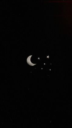 the moon and stars are in the dark sky