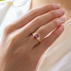 Ruby Engagement Ring, Yellow Gold Ring, Oval Cut Diamond Trilogy Ring, Wedding Ring, Promise Ring, Gemstone Jewelry, Rings, Art Deco Ring ♠ Stone Details ➵ 1.15 Ct Approx. Total Oval Cut Ruby ➵ Side Stone Weight: 0.30Ct Round Cut Simulated Diamond ➵ Band Width: 2.0mm ➵ Gemstone: Ruby ➵ Side Stone: Simulated Diamond ➵ Stone Color (Red) ➵ Stone Luster: Excellent ➵ Stone Clarity: VVS1 ➵ Stone Make: High Quality ➵ Center Stone Shape: Oval Cut Ruby ➵ Metal Change(10k/14k/18k White/Yellow/Rose Gold) ➵ Ruby Trilogy Ring, Oval Ruby Jewelry With Brilliant Cut For Weddings, Fine Jewelry Three Stone Rings For Proposal, Oval Ruby Ring With Three Diamonds, Oval Three Stone Ruby Ring With Diamonds, Classic Three Stone Ruby Promise Ring, Gold Oval Ruby Ring With Three Stones, Classic Three Stone Ruby Ring For Wedding, Gold Ruby Ring With Three Stones, Oval Shaped