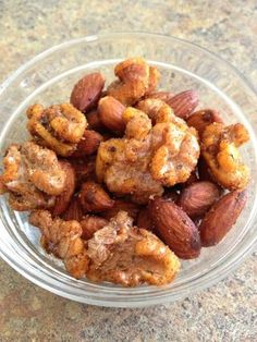 a bowl filled with nuts on top of a table