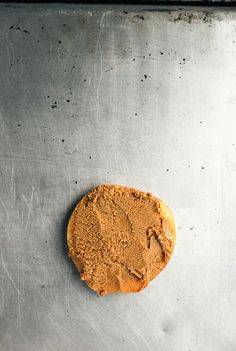 a cookie sitting on top of a metal pan