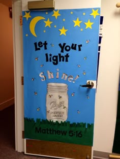 a door decorated with an image of a mason jar and the words let your light shine