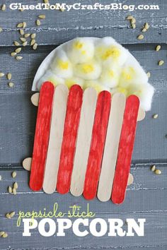 popsicle stick popcorn craft for kids to make with corn kernels and marshmallows