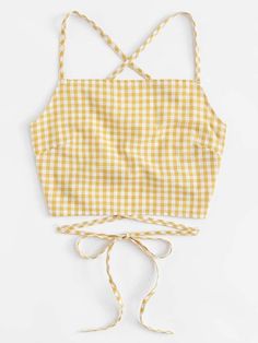 a yellow and white gingham top with ties around the waist, on a white background