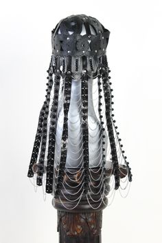 This headpiece is inspired by the female hats of the old Mongolian Ordo tribe. The married woman, and especially the mother of the male children, was very appreciative and wealthy. While the husbands were hunting, fighting and property enlargement, Ordo's wife was the head of the house as the chief administrator of the entire property. They wore luxurious caps of felt or leather with a plenty of corals and turquoise sewn on it. A lot of silver parts and swabs on the front and back were sewn on l Unique Festival Headpiece With Tall Crown, Unique Tall Crown Headpiece For Festival, Ceremonial Black Adjustable Headpieces, Adjustable Black Ceremonial Headpiece, Traditional Party Headpieces With Bead Caps, Traditional High Crown Headpiece For Party, Traditional Round Crown Headpiece For Party, Evening Headpiece With Tall Crown, Festival Bead Caps Headpiece