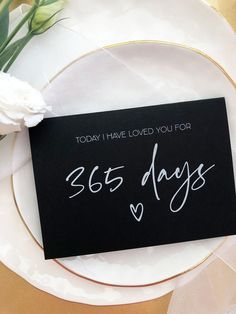 a black card with white writing that says, today i have loved you for 365 days