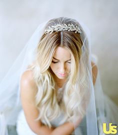 a woman with blonde hair wearing a veil