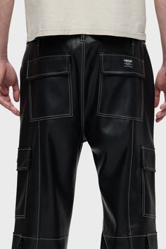 Description Our Vegan Leather Baggy Cargo in Black Sky is cut from luxe, vegan leather with contrast stitching and cargo details including side and back patch pockets. For a less roomy fit, size down. Product Details Front Rise: 12.25", Leg Opening: 18.5", Inseam: 32"Model Height 6’1"Model wearing size 32 Fit & Care Content: 100% PolyeurethaneMachine wash cold with like colorsDo not bleachTumble dry low or hang to dry Leather Cargo Pants, Black Sky, Black Cargo Pants, Into The Night, Black Cargo, Kick Flares, Denim Branding, Men Fits, Hudson Jeans