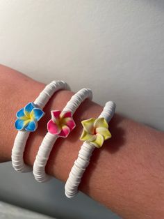 Super adorable bracelets for the summer! durable, made with super stretchy elastic, your choice for the flowers color :) Casual Beaded Bracelets With Flower Beads For Beach, Casual Flower Beaded Bracelets For Beach, Casual Flower-shaped Beaded Bracelets For Beach, White Flower Jewelry For Vacation, Handmade Flexible White Bracelets, Casual Flower Bracelets For Beach, Adjustable Flower Beaded Bracelets For Beach, Multicolor Flower Bracelets For Beach, Trendy Flexible Stretch Bracelet In White