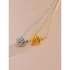 Add a touch of romance with our Gold Rose Pendant Necklace. This delicate floral charm necklace is perfect for elegant and everyday wear. Shop now at Tomoko Store for timeless beauty Finish: 18K Gold plated Waterproof: does not change color from water exposure Lead and nickel free Material: Stainless steel(waterproof!) Size: 42x5cm Weight: 5g All our jewelry are made of stainless steel material. For the gold pieces, we added an 18K PVD gold plating. This means the colour will last for a really l Elegant Rose Necklaces With Clavicle Chain, Elegant Rose Design Charm Necklace For Gift, Elegant Rose Design Charm Necklace Gift, Delicate Rose Gold Flower Necklace With Clavicle Chain, Elegant Rose Necklaces For Valentine's Day, Elegant Rose Design Necklace For Mother's Day, Elegant Rose Flower Pendant Charm Necklaces, Elegant Rose Gold Flower Charm Necklaces, Feminine Rose Gold Flower Charm Necklace