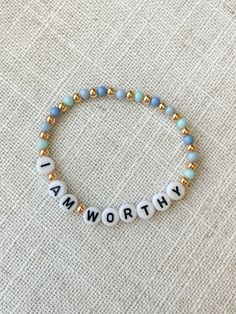 "Mommy and Littles Co affirmations \"I am Worthy\" bracelet. Such a small item can make such a big difference! Details: *4mm gumball beads. *acrylic black and white letter beads. *4mm 14k gold plated beads. *Made with jewelry quality elastic. *please message if you are needing a size that is not listed! *NOTE: this listing is for ONE bracelet." Handmade Inspirational Stretch Bracelet As Gift, Handmade Inspirational Stretch Bracelet Gift, Inspirational Handmade Stretch Bracelet As Gift, Inspirational Handmade Stretch Bracelet Gift, Inspirational Beaded Bracelets For Everyday, Inspirational Handmade Stretch Bracelet, Inspirational White Handmade Friendship Bracelets, Handmade Inspirational Bracelets For Friendship, Inspirational Round Beads Friendship Bracelets As Gift