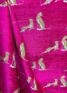 pink and gold fabric with leopards on it