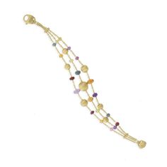 18K yellow gold and gemstone triple strand bracelet. Inspired by the soft dunes of the Sahara, this Africa Gemstone bracelet is hand engraved by Italian artisans and adds a touch of color to your wardrobe. ITEM # BB2266 MIX02 Y 02 18K Yellow Gold Cheap Multi-strand Gold Bracelets, Luxury Double Strand Natural Stones Jewelry, Luxury Classic Multi-strand Jewelry, Luxury Multi-strand Beaded Bracelets, Luxury Double Strand Gold Bracelet, Affordable Multi-strand Gold-tone Jewelry, Luxury Gold Multi-strand Jewelry, Luxury Double Strand Beaded Bracelets As Gift, Luxury Double Strand Gold Bracelets