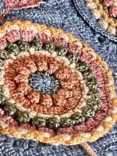 a crocheted dishcloth with a circular design on it