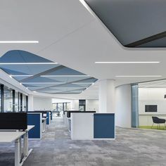 an empty office with desks and chairs