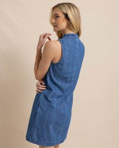 It's denim done right with our simple yet sophisticated sleeveless dress. The slight A-line cut and 100% cotton construction keep you comfortable, while the ruffled collar adds some feminine flair. Perfectly placed pockets are poised for relaxed poses from brunch to the boardwalk. Style: 10887 Sleeveless Dark Wash Workwear Dress, Dark Wash Sleeveless Dress For Work, Sleeveless Dark Wash Dress For Work, Casual Sleeveless Denim Dress With Ruffles, Sleeveless Cotton Denim Dress With Ruffles, Cotton Ruffled Denim Dress, Ruffled Cotton Denim Dress, Cotton Denim Dress With Ruffles, Sleeveless Denim Daywear Dress