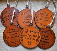 six handmade leather ornament with bible verses on them