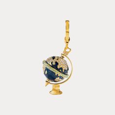 a blue and white globe with gold accents on a silver base, hanging from a chain