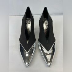 This Item Is New Without Box . To Prevent Any Illegal Store Returns There Is A Line Through The Designer Name Givenchy Brings To You These Lovely Pumps To Complement Your Fashionable Ensembles. These Metallic Silver Pumps Are Crafted From Leather And Feature A Pointed-Toe Silhouette. They Flaunt Black Elastic Panels On The Sides, 10 Cm Heels, And Comfortable Leather-Lined Insoles. Silver Patent Leather Pointed Toe Heels, Silver Pointed Toe Heels In Patent Leather, Silver Pointed Toe Patent Leather Heels, Metallic Silver Leather Heels With Pointed Toe, Silver Patent Leather Heels For Formal Occasions, Formal Silver Patent Leather Heels, Metallic Silver Modern Heels For Formal Occasions, Modern Metallic Silver Heels For Formal Occasions, Silver Heels With Contrasting Heel Counter For Evening