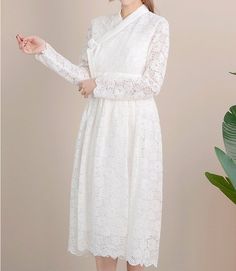 This is a Korean Modern Hanbok Dress for Women.It is wrap style lace long dress in white color.This hanbok is modernly designed so you can wear it comfortably and beautifully.This modern hanbok is perfect dress for special celebrations such as wedding, engagement parties or various events. If you choose a Dress and Chiffon Skirt together, the skirt worn by the model in the photo will be delivered.⭐You can create a variety of styles by layering skirts of different colors on this dress. Go look Mo White Lace Trim Dress For Banquet, White Lace Dress For Spring Banquet, White Lace Dress With Lace Bodice For Ceremonies, Long Sleeve Lace Patchwork Wedding Night Dress, White Long Sleeve Lace Dress For Wedding Guest, Elegant Wedding Lace Dress With Lace Cuffs, Elegant Lace Wedding Dress With Lace Cuffs, White Lace Sleeve Dress For Banquet, White Lace Sleeve Banquet Dress