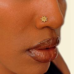 a close up of a person with a nose piercing