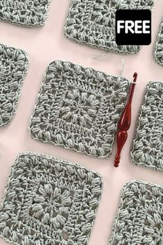 a crocheted square is shown with a pair of red handled scissors on it