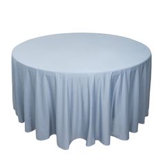 a round table with a light blue cloth on the top and white linen around it