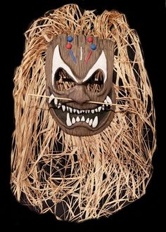 * * * A Halloween-Mask.com Exclusive * * * Searching for a mask to take to a deserted island, tribal ritual or a luau party?  Well, look no further!  Our Evil Tiki mask is equally at home in any of these settings. The mask features a carved wood appearance, tribal decorations, teeth, pierced nose and long grass hair.   Latex face mask with grass hair and strap Made in the USA. Rubbish Art, Pierced Nose, Deserted Island, Tiki Mask, Witch Doctor, Costume Masks, Halloween Mask, Costume Mask, Luau Party