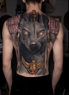 the back of a man's body with an image of a wolf on it