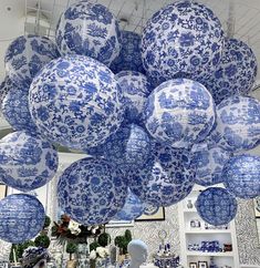 large blue and white paper lanterns hanging from the ceiling