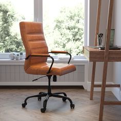 an office chair sitting in front of a window