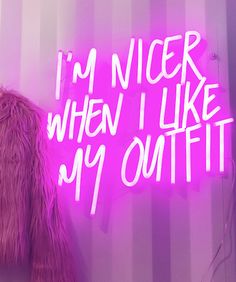 a pink neon sign that says i'm nicer when i like my outfit