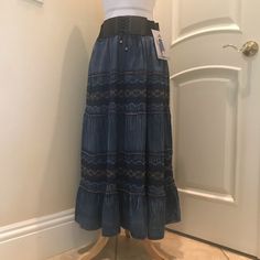 Nwt Lapis Maxi Skirt Is A Tiered Denim Style , With Built In Tie Front Belt Design, Elastic Back,And Beautiful Embroidered Details. New With Tag . See Close Up Photos For Colors And Details. Blue Non-stretch Mid-rise Skirt, Medium Wash Denim Tiered Skirt, Non-stretch Mid-rise Blue Skirt, Casual Blue Long Denim Skirt, Blue Non-stretch Denim Skirt, Non-stretch Blue Denim Skirt, Fitted Tiered Denim Skirt, Bohemian High Waist Dark Wash Bottoms, Bohemian Dark Wash High Waist Bottoms