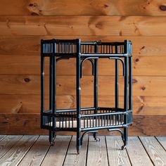 With classic lines and a timeless black finish, our rolling Rattan Bar Cart is both beautiful and useful. The contrasting natural woven shelves make it a perfect addition to any space where casual cocktails might be served. The legs feature antique brass casters, so your party won't be confined to just one room. Shop this and more bar carts at Dartbrook Rustic Goods! Surfing Cowboy, Rustic Porch Ideas, Rattan Bar Cart, Rattan Bar, Black Rattan, Rustic Porch, Bar Cart Styling, Basement Makeover, Rustic Storage